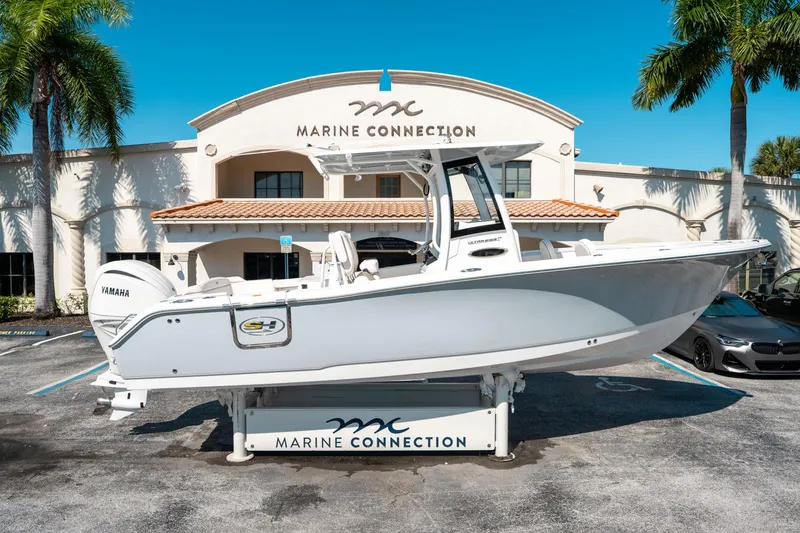 Slide: The Image of 2025 Sea Hunt Ultra 255 SE boat displayed at Marine Connection dealership. - 1