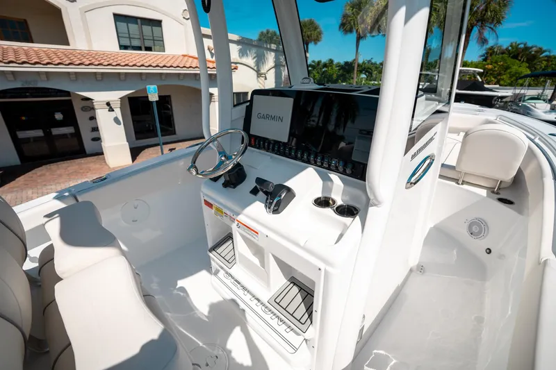 Slide: The Image of 2025 Sea Hunt Ultra 255 SE boat interior with Garmin navigation system and sleek design. - 25