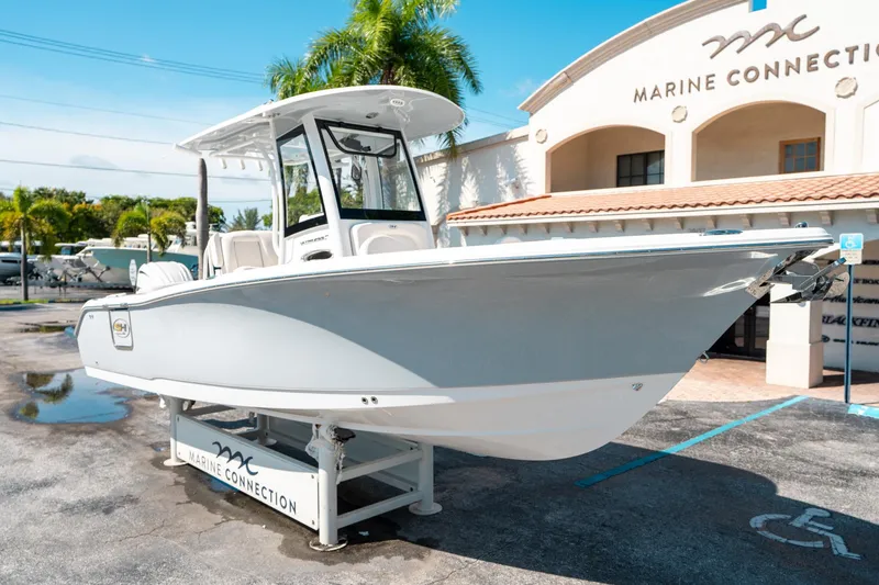 Slide: The Image of 2025 Sea Hunt Ultra 255 SE boat displayed at Marine Connection dealership. - 8