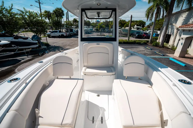 Slide: The Image of 2025 Sea Hunt Ultra 255 SE boat interior with white seating and modern design. - 36