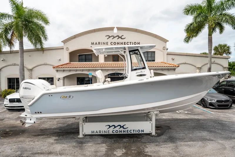 Slide: The Image of 2025 Sea Hunt GAMEFISH 27 CB boat displayed at Marine Connection dealership. - 1