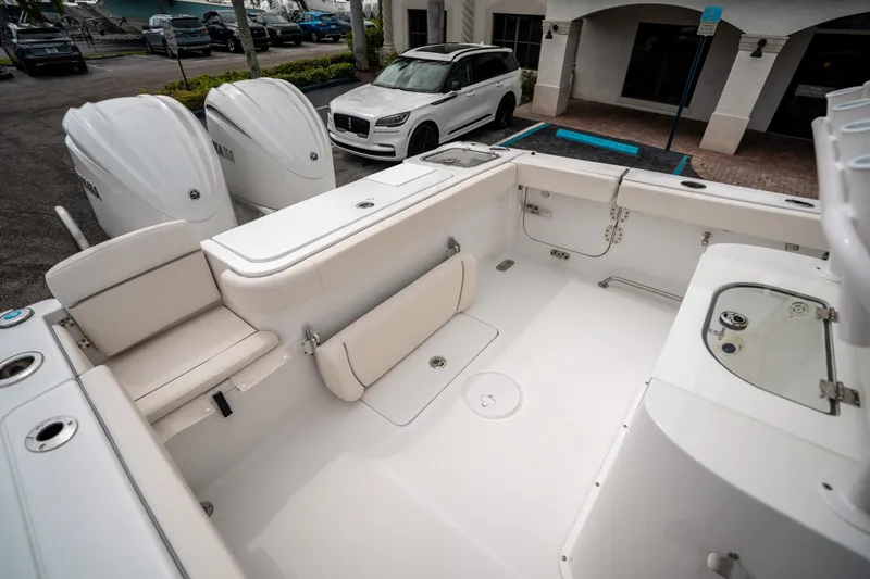 Slide: The Image of 2025 Sea Hunt GAMEFISH 27 CB boat interior with dual Yamaha engines, spacious seating, and fishing amenities. - 12