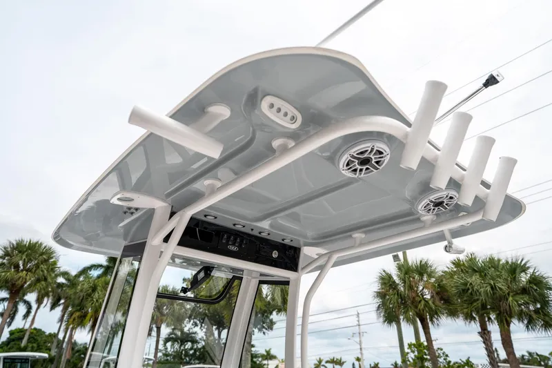 Slide: The Image of 2025 Sea Hunt GAMEFISH 27 CB boat top with rod holders and speakers. - 23