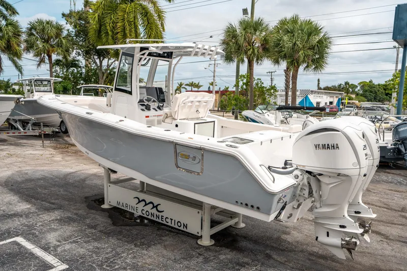 Slide: The Image of 2025 Sea Hunt GAMEFISH 27 CB boat with Yamaha engines, displayed at Marine Connection. - 4