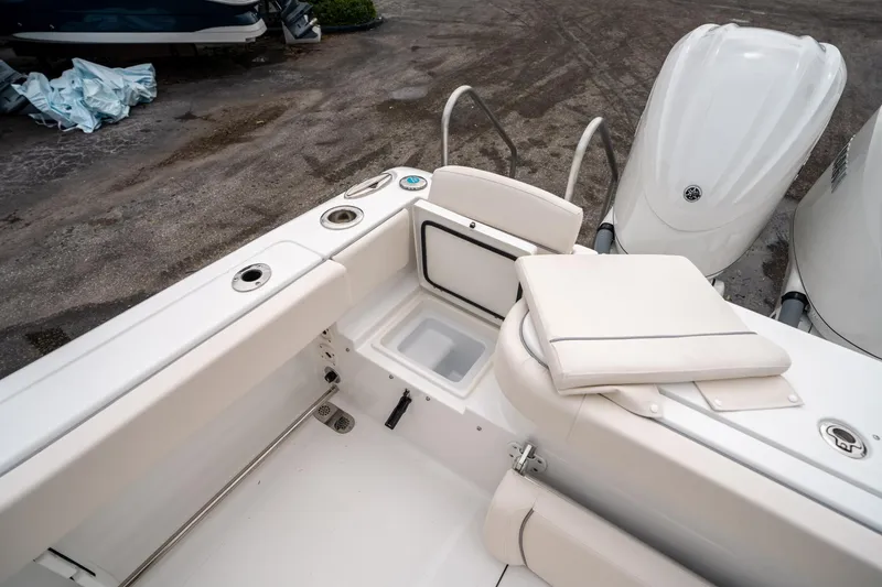 Slide: The Image of 2025 Sea Hunt GAMEFISH 27 CB boat interior with seating and storage compartments. - 16