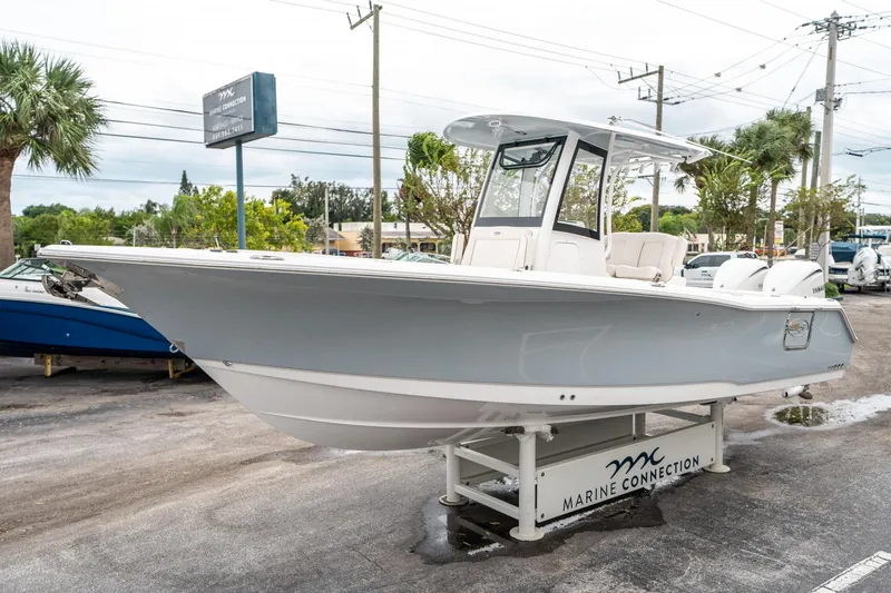 Slide: The Image of 2025 Sea Hunt GAMEFISH 27 CB boat displayed at Marine Connection dealership. - 6