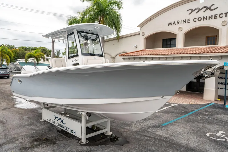 Slide: The Image of 2025 Sea Hunt GAMEFISH 27 CB boat displayed at Marine Connection dealership. - 8