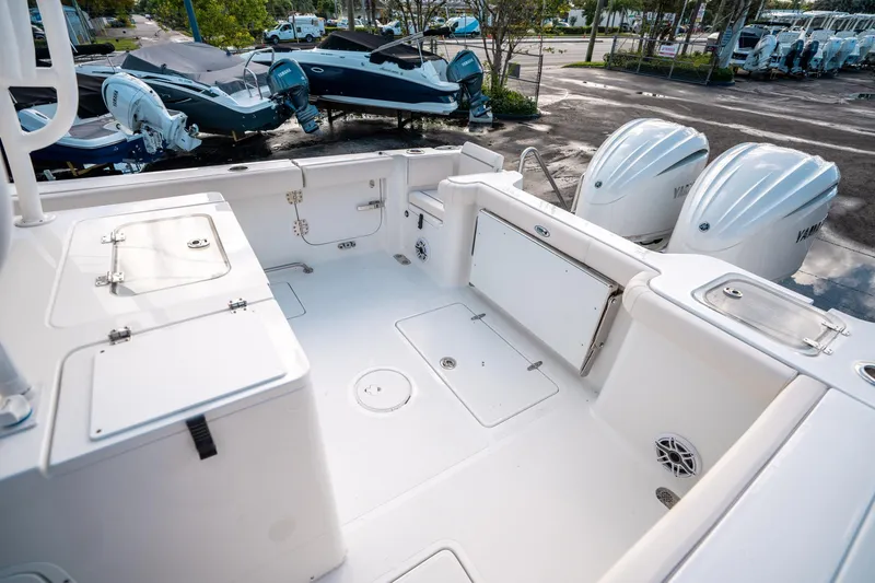 Slide: The Image of 2025 Sea Hunt Gamefish 30 FS boat deck with dual Yamaha engines, spacious layout. - 11