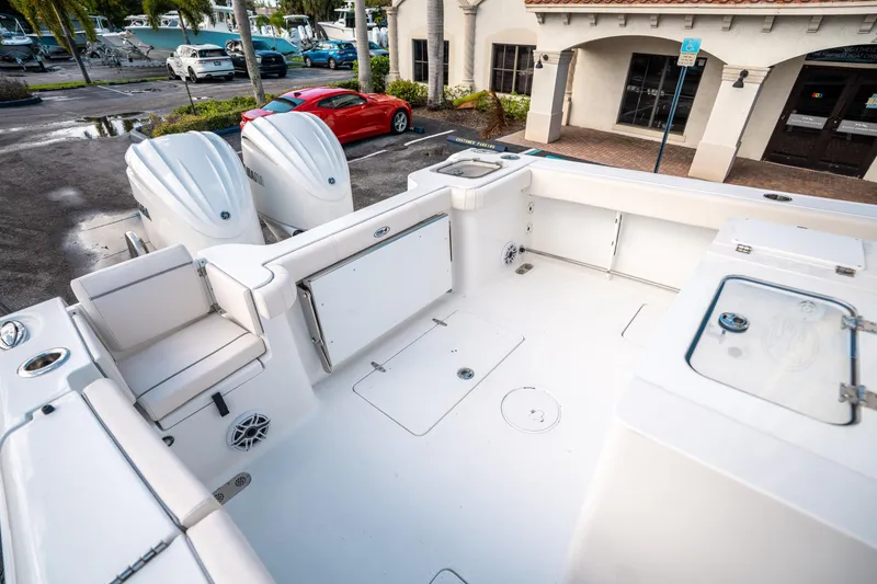 Slide: The Image of 2025 Sea Hunt Gamefish 30 FS boat interior with dual engines and seating. - 12