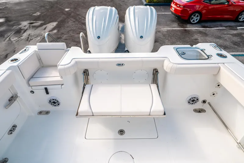 Slide: The Image of 2025 Sea Hunt Gamefish 30 FS boat interior with seating and dual engines. - 13