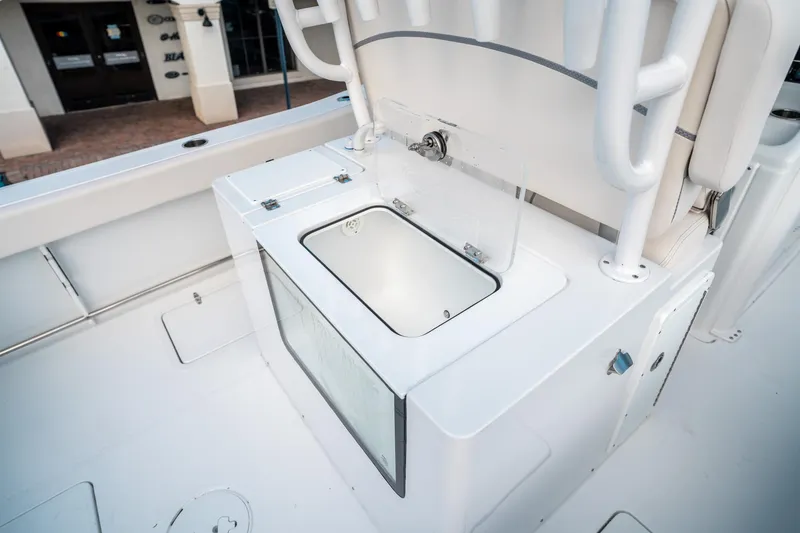Slide: The Image of 2025 Sea Hunt Gamefish 30 FS boat interior with open storage compartment. - 17