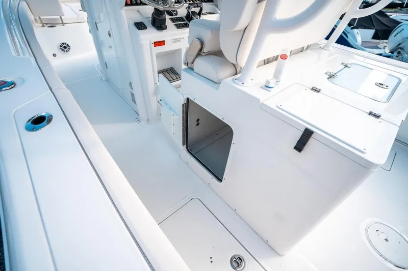 Slide: The Image of 2025 Sea Hunt Gamefish 30 FS boat interior with storage compartments and seating. - 21