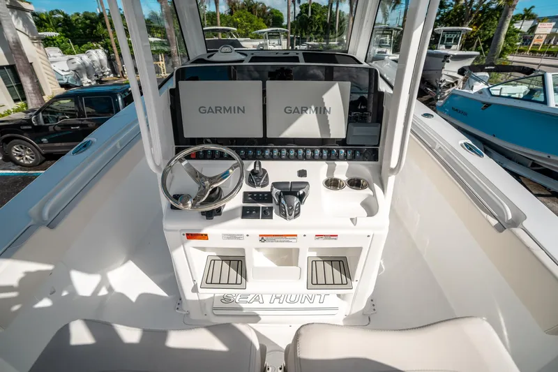Slide: The Image of 2025 Sea Hunt Gamefish 30 FS boat dashboard with Garmin navigation system. - 23