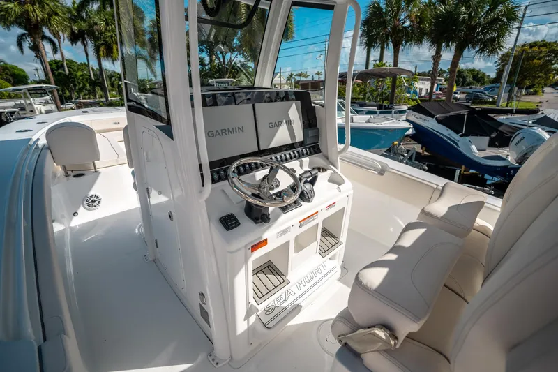 Slide: The Image of 2025 Sea Hunt Gamefish 30 FS boat interior with Garmin navigation system. - 24