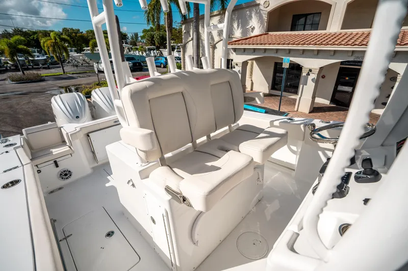 Slide: The Image of 2025 Sea Hunt Gamefish 30 FS boat interior with dual seating and steering console. - 28