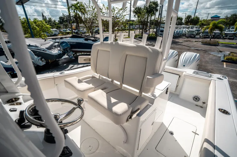 Slide: The Image of 2025 Sea Hunt Gamefish 30 FS boat interior with helm and seating area. - 29
