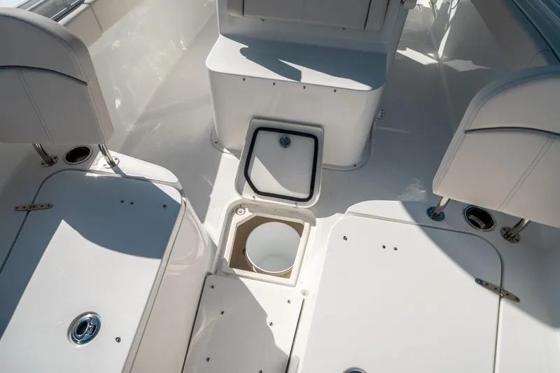 Slide: The Image of 2025 Sea Hunt Gamefish 30 FS boat interior with storage compartments and seating. - 42