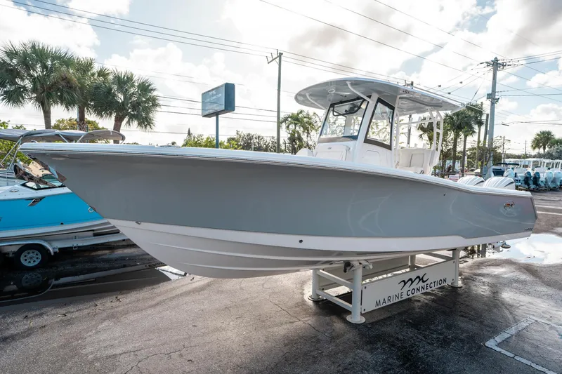 Slide: The Image of 2025 Sea Hunt Gamefish 30 FS boat displayed at Marine Connection dealership. - 6