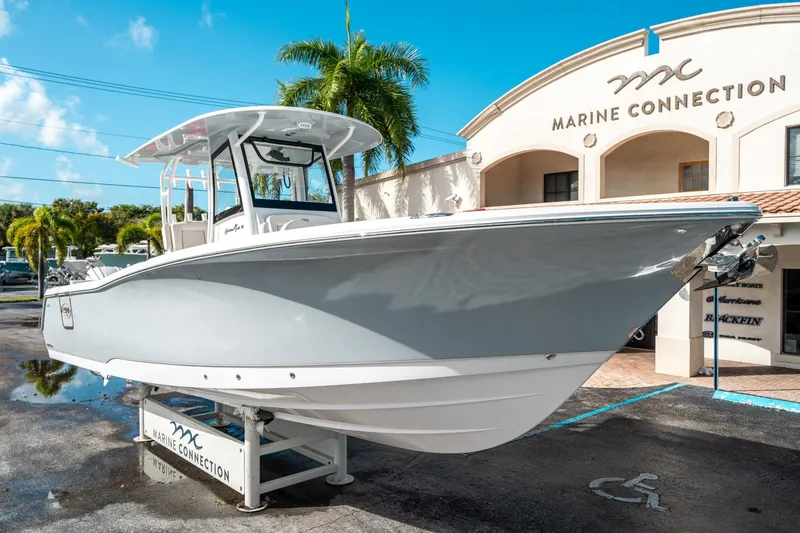Slide: The Image of 2025 Sea Hunt Gamefish 30 FS boat displayed at Marine Connection dealership. - 8
