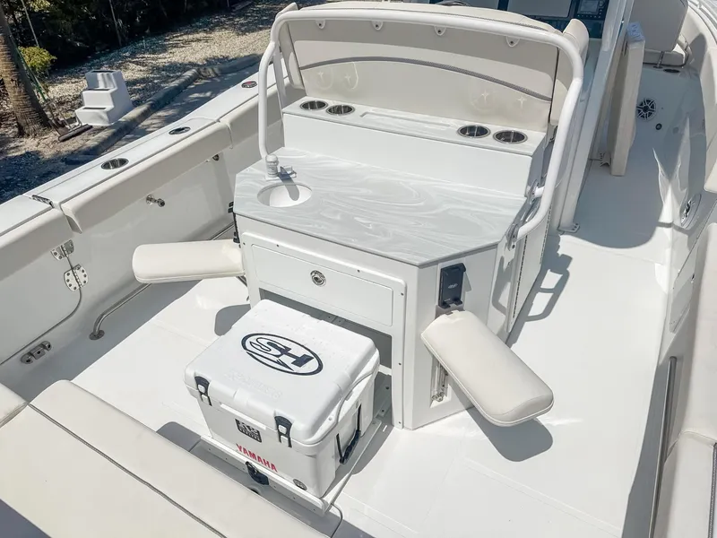 Slide: The Image of 2025 Sea Hunt Ultra 275 SE boat interior with seating and storage. - 10