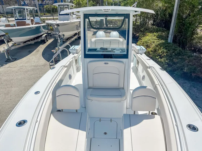 Slide: The Image of 2025 Sea Hunt Ultra 275 SE boat, spacious deck, white seating, outdoor display. - 26