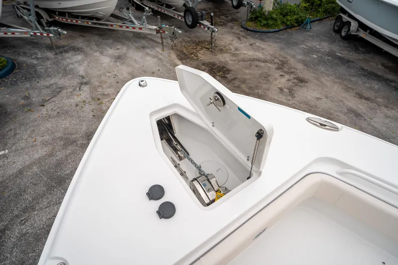 Slide: The Image of 2025 Sea Hunt Gamefish 27 FS boat with open anchor storage compartment. - 45