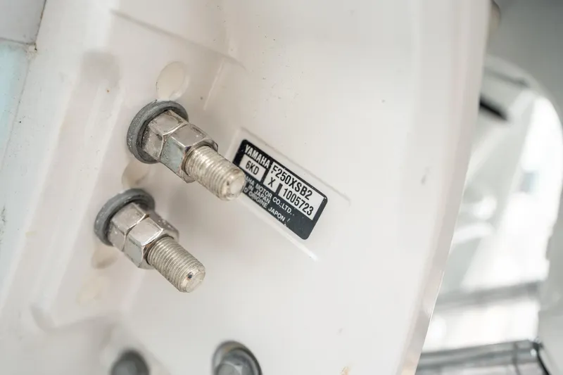 Slide: The Image of Close-up of Yamaha motor bolts on 2025 Sea Hunt Gamefish 27 FS. - 47