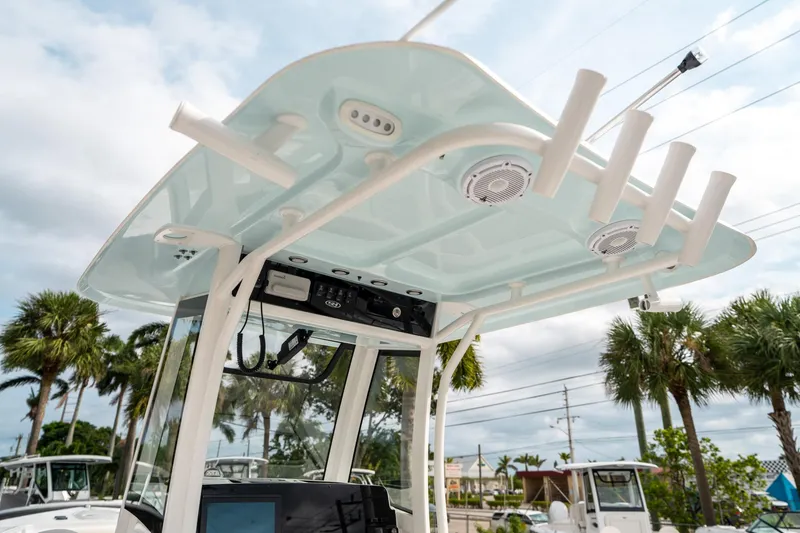 Slide: The Image of 2025 Sea Hunt Gamefish 27 FS boat with T-top and rod holders. - 23