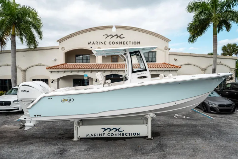 Slide: The Image of 2025 Sea Hunt Gamefish 27 FS boat displayed at Marine Connection dealership. - 1