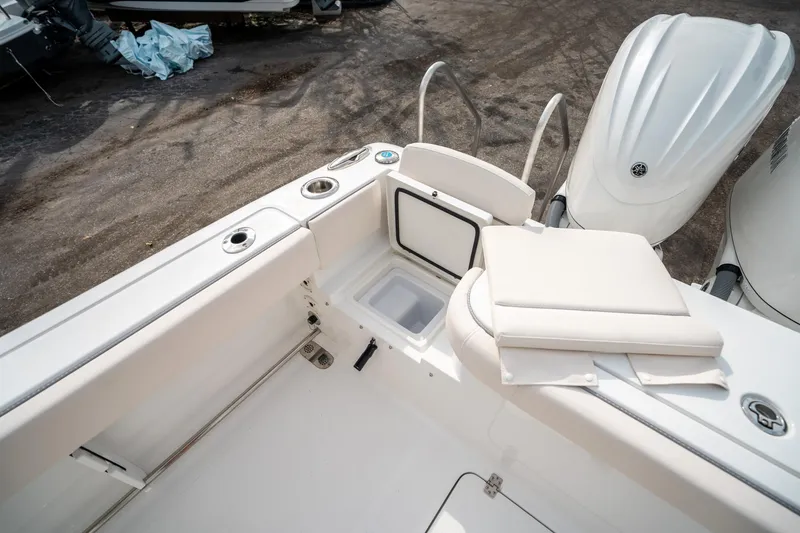 Slide: The Image of 2025 Sea Hunt Gamefish 27 FS boat interior with seating and storage compartments. - 15