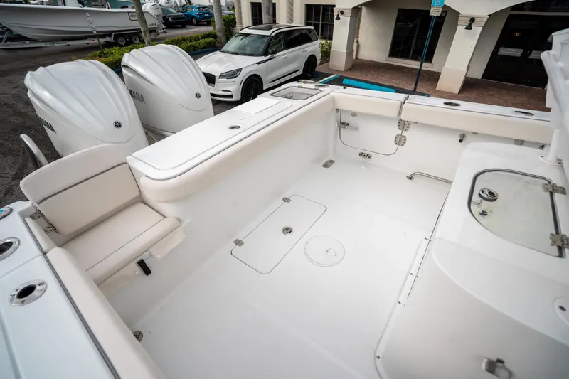 Slide: The Image of 2025 Sea Hunt Gamefish 27 FS boat interior with spacious seating and storage. - 12