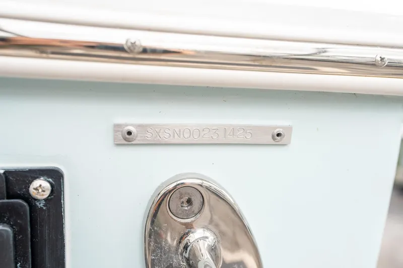 Slide: The Image of 2025 Sea Hunt Gamefish 27 FS hull identification number plate. - 48