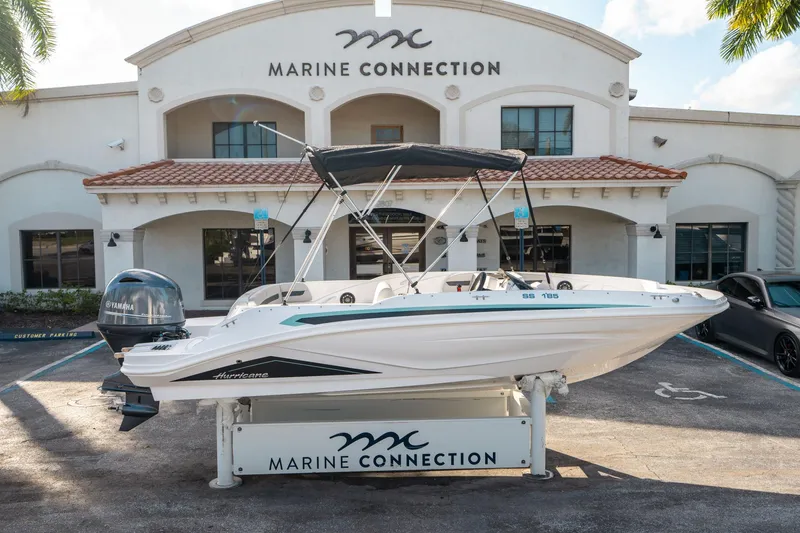 Slide: The Image of 2025 Hurricane SunDeck Sport 185 OB boat displayed at Marine Connection dealership. - 1
