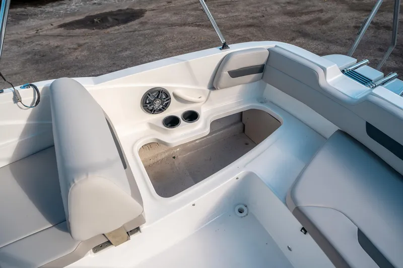 Slide: The Image of Interior of 2025 Hurricane SunDeck Sport 185 OB boat with seating and cup holders. - 14