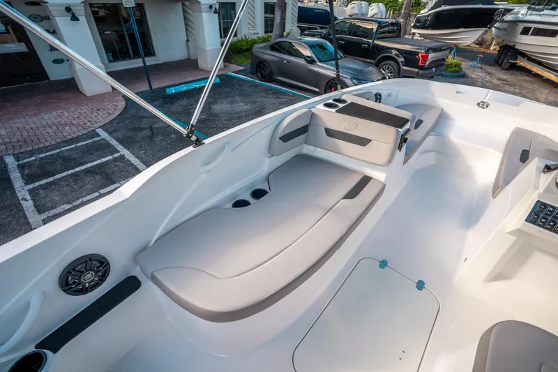 Slide: The Image of 2025 Hurricane SunDeck Sport 185 OB boat interior with seating and cup holders. - 15