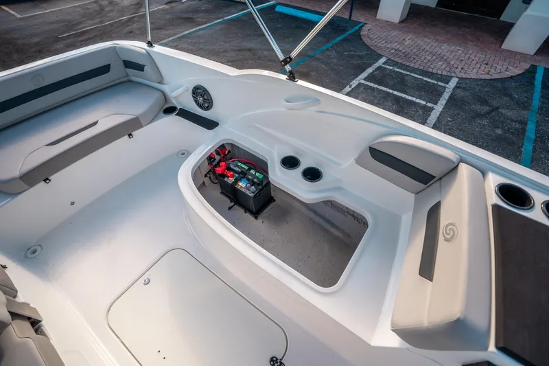 Slide: The Image of 2025 Hurricane SunDeck Sport 185 OB boat interior with seating and storage area. - 16