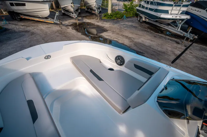 Slide: The Image of 2025 Hurricane SunDeck Sport 185 OB boat interior with gray seating and speaker. - 22