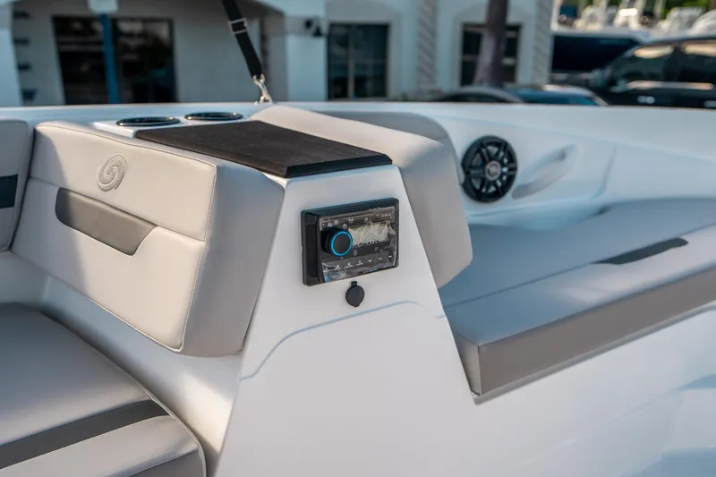 Slide: The Image of 2025 Hurricane SunDeck Sport 185 OB boat interior with modern seating and audio system. - 23