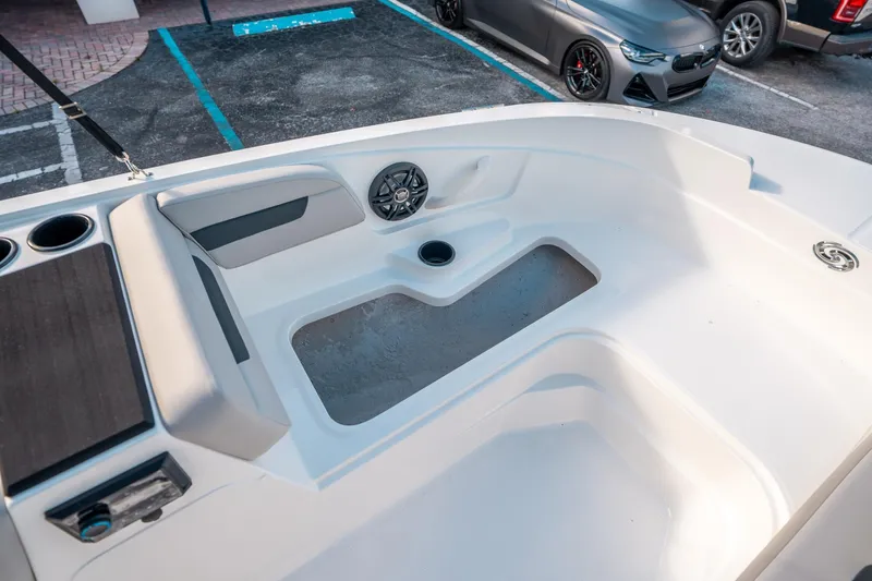 Slide: The Image of 2025 Hurricane SunDeck Sport 185 OB boat interior with seating and speaker system. - 24