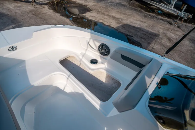 Slide: The Image of 2025 Hurricane SunDeck Sport 185 OB boat interior with seating and speaker. - 25