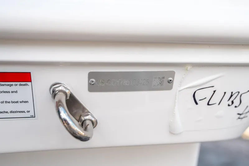 Slide: The Image of 2025 Hurricane SunDeck Sport 185 OB boat identification plate and safety warning label. - 28