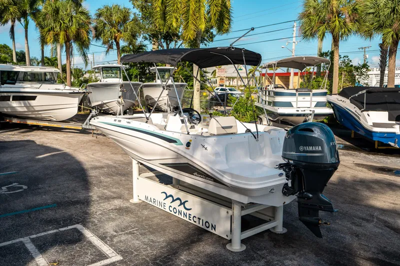 Slide: The Image of 2025 Hurricane SunDeck Sport 185 OB boat displayed at Marine Connection dealership. - 4