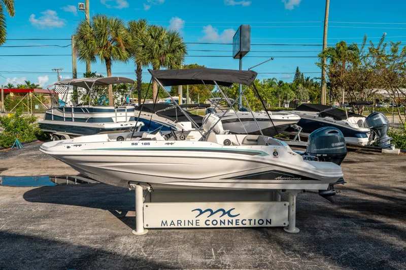 Slide: The Image of 2025 Hurricane SunDeck Sport 185 OB boat displayed at Marine Connection dealership. - 5