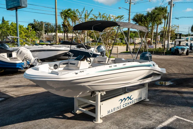 Slide: The Image of 2025 Hurricane SunDeck Sport 185 OB boat displayed at Marine Connection dealership. - 6