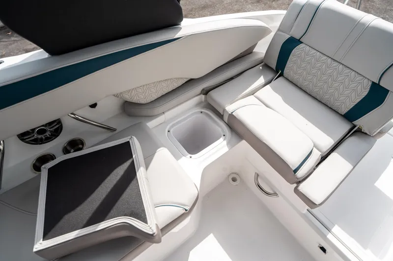 Slide: The Image of 2025 Hurricane SunDeck 2600 OB boat interior with comfortable seating and modern design. - 14
