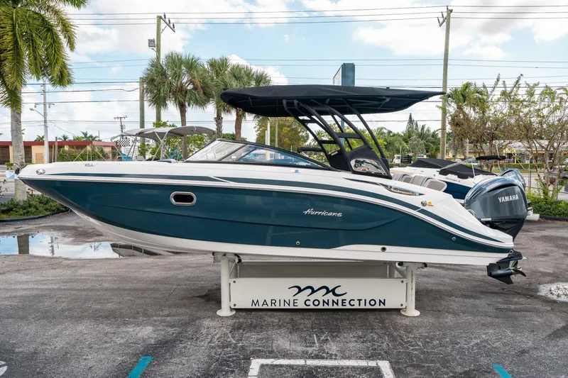 Slide: The Image of 2025 Hurricane SunDeck 2600 OB boat displayed at Marine Connection dealership. - 5