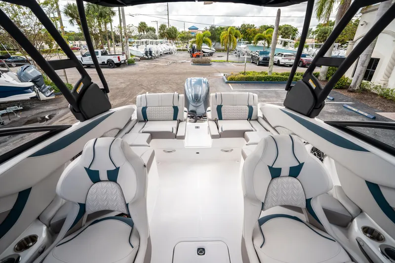 Slide: The Image of 2025 Hurricane SunDeck 2600 OB boat interior with luxurious seating and modern design. - 10