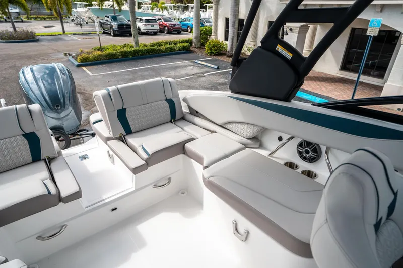 Slide: The Image of 2025 Hurricane SunDeck 2600 OB boat interior with plush seating and modern design. - 11