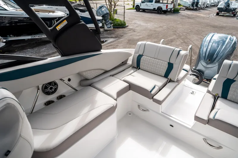 Slide: The Image of 2025 Hurricane SunDeck 2600 OB boat interior with luxurious seating and modern design. - 12
