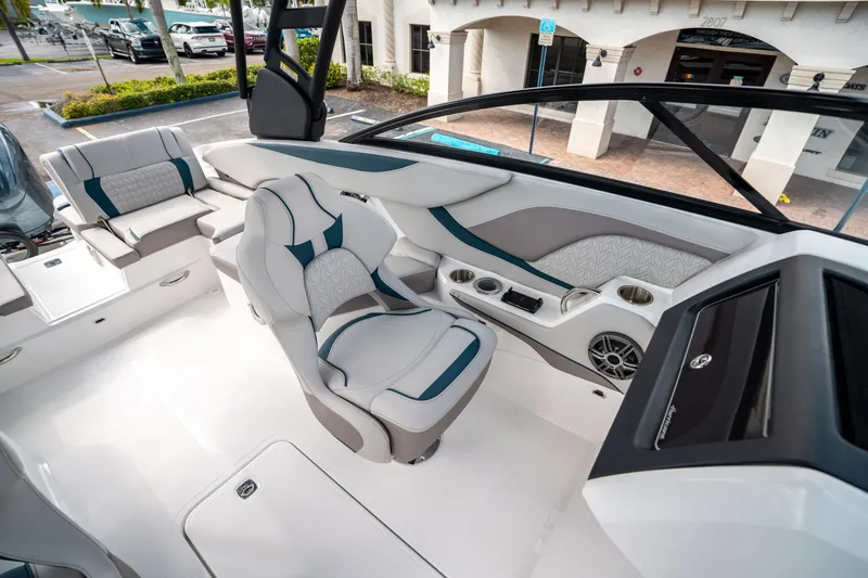 Slide: The Image of 2025 Hurricane SunDeck 2600 OB boat interior with modern seating and dashboard design. - 22